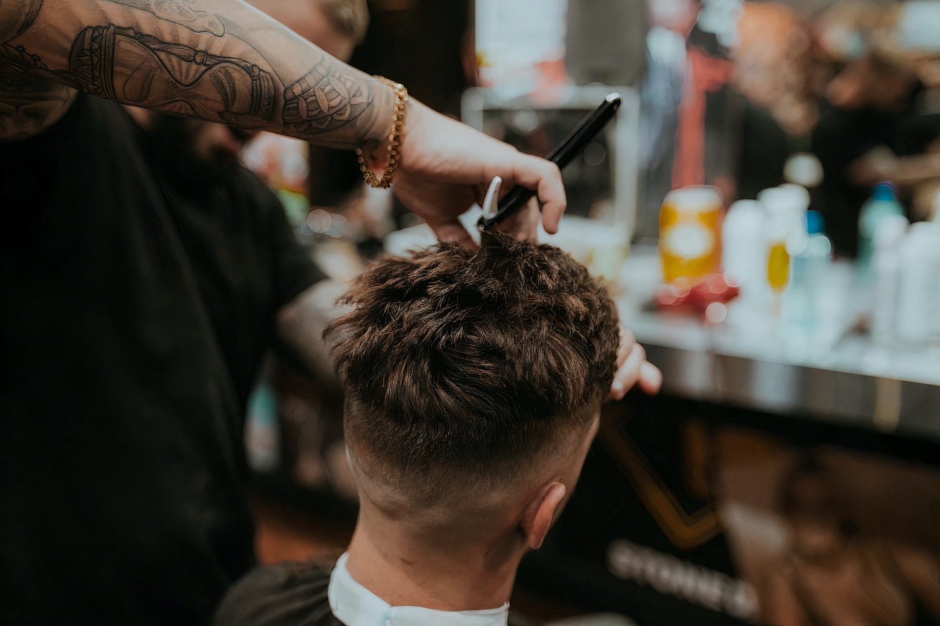 man getting his hair cut